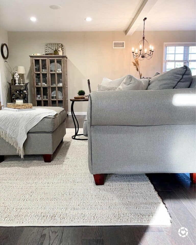Grey Living Room Décor With Black-framed Chandelier