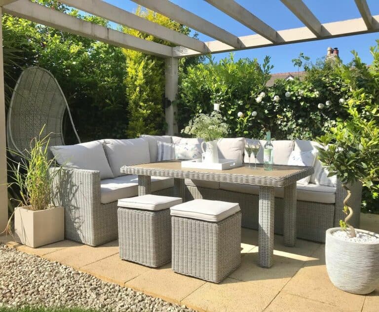 White Pergola With Gray Wicker Furniture