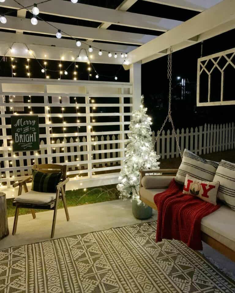 White Pergola With Hanging Patio Swing