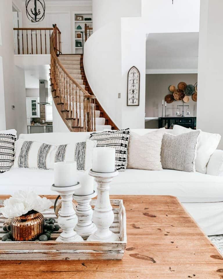 Curved Wooden Staircase With a Carpet Runner