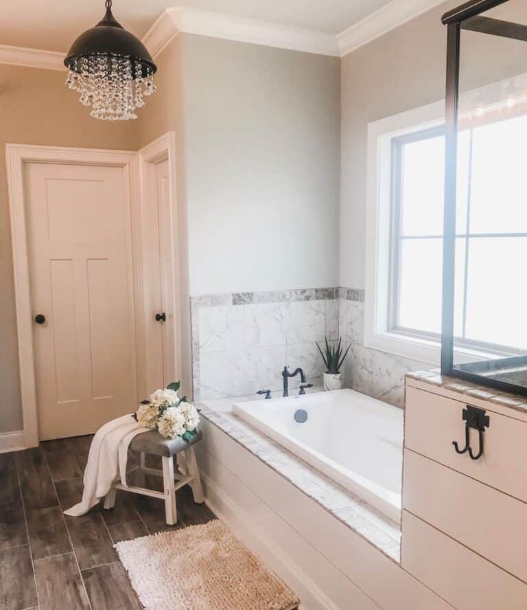 Bathtub with Gray Tile Ledge and Surround