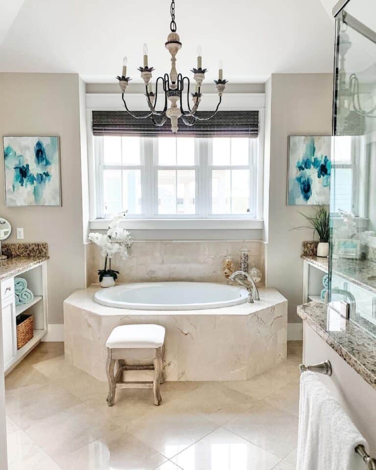 Chrome Faucet on Beige Marble Bathtub Ledge