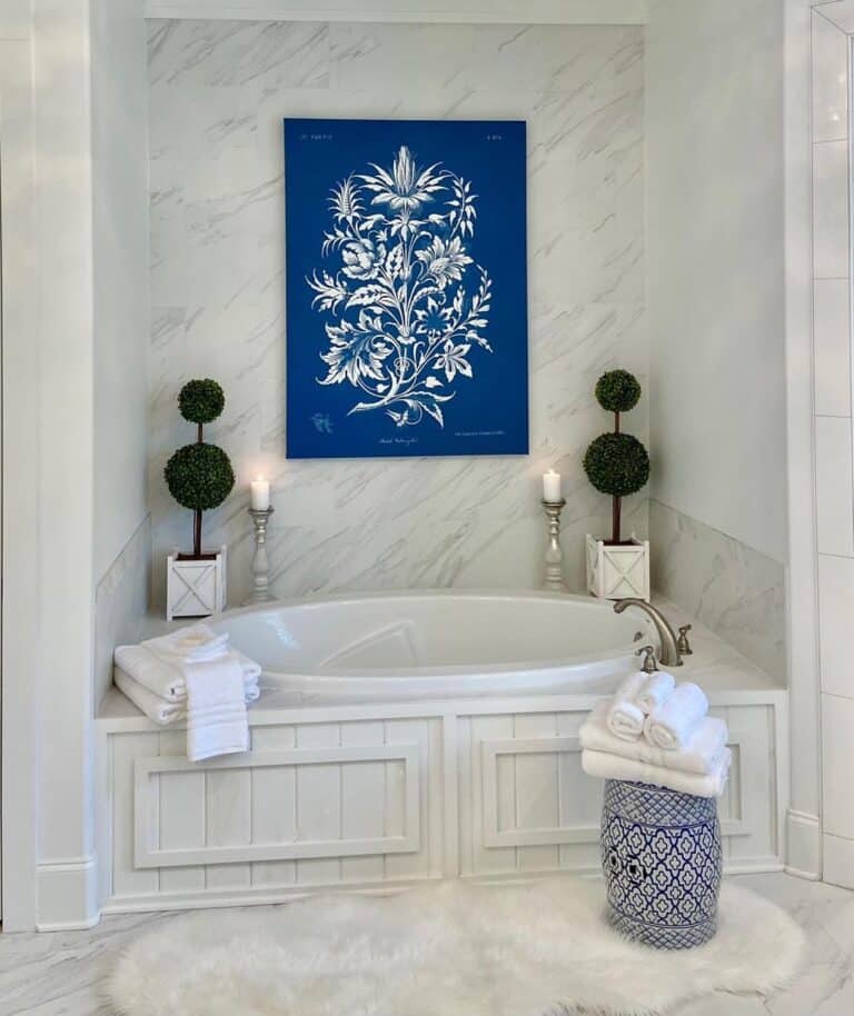 Blue Décor Around White Alcove Bathtub