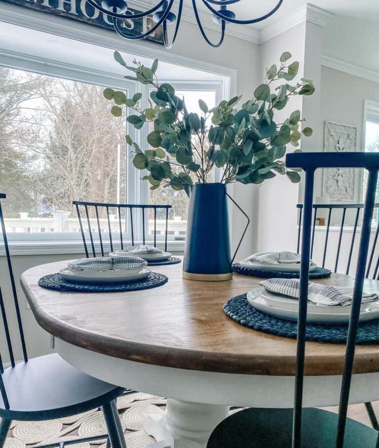 Blue and Gold Jug Holding Greenery Centerpiece