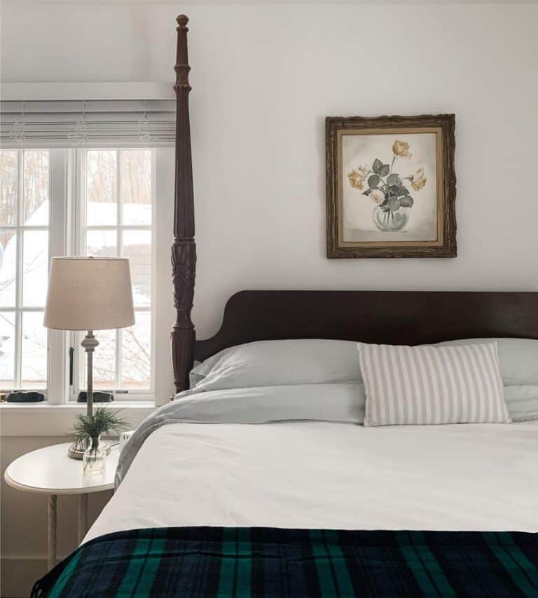 Four Poster Bed with Blue and Green Plaid Blanket