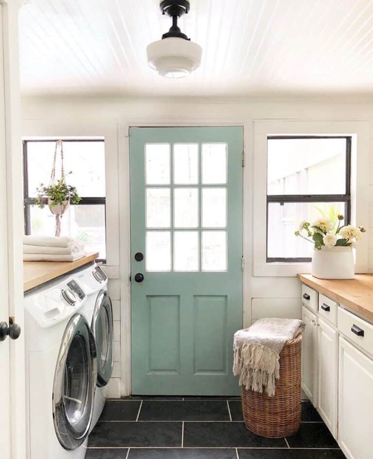 Laundry Room with Black Tile Flooring
