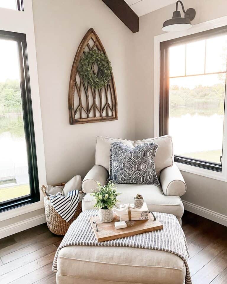Upholstered Armchair in living room painted in Agreeable Gray by SW