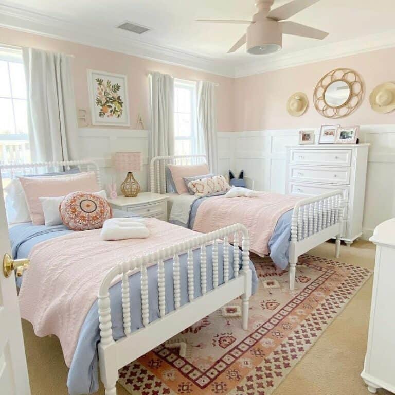 Cozy Bedroom With Blue Coverlets on White Beds