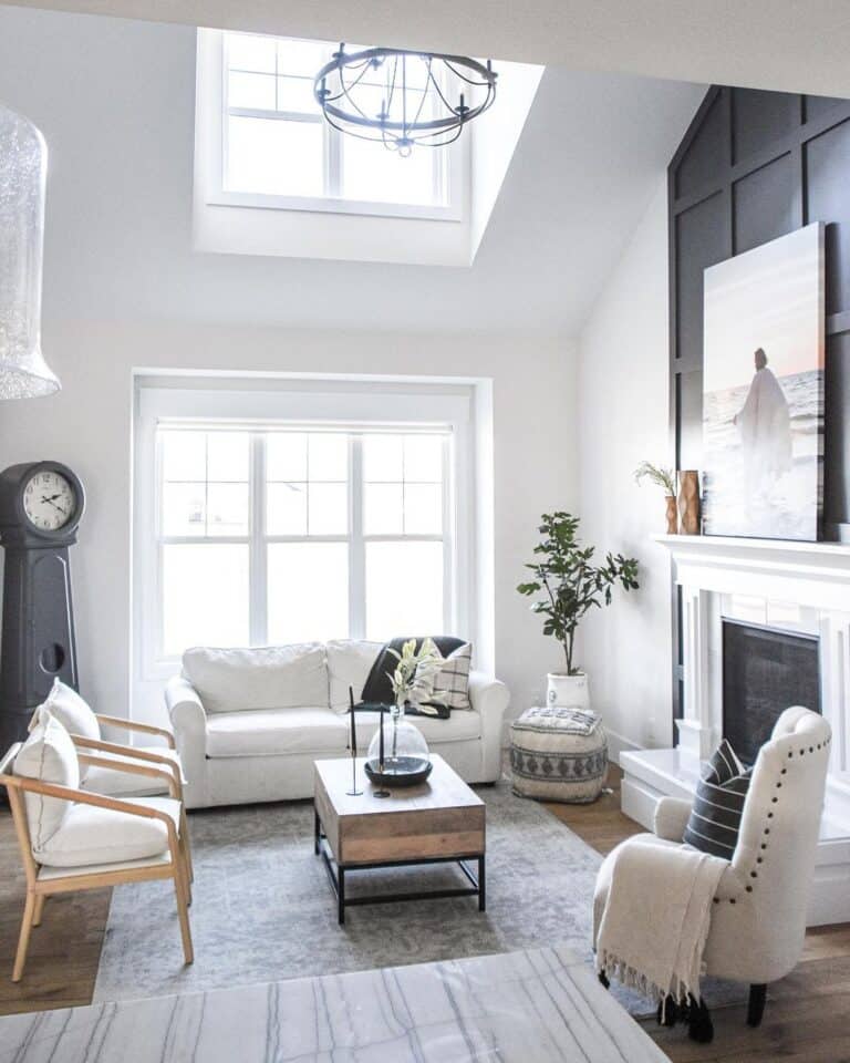 Living Room with Small White Couch and Chairs