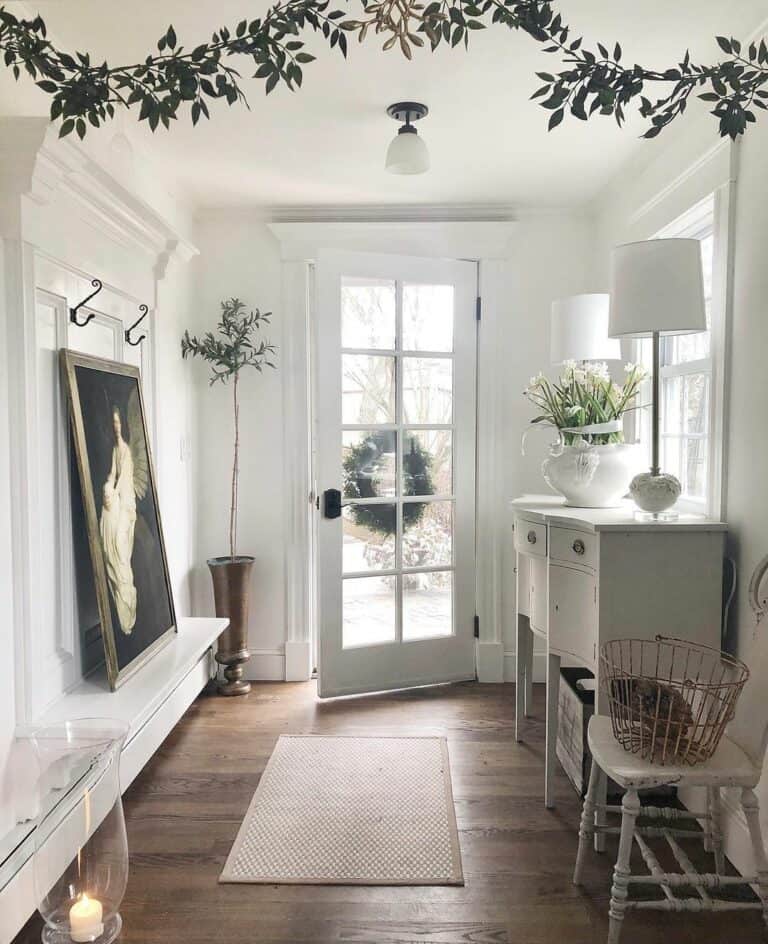 Entryway With Black and White Foyer Light Fixtures