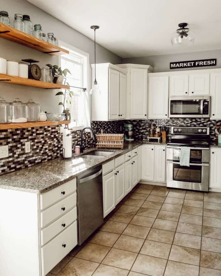 Stainless Steel With Checkboard Backsplash and Black Hardware