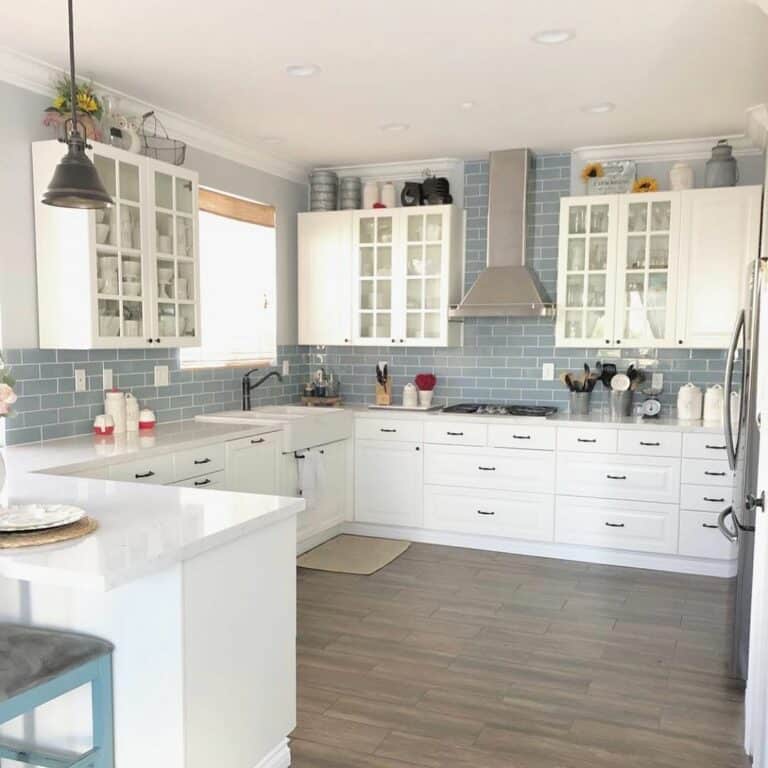 Blue Subway Tile in White Kitchen With Black Hardware