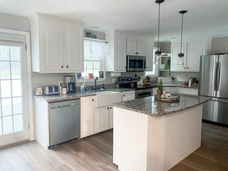 Kitchen With Black Hardware and Light Fixtures