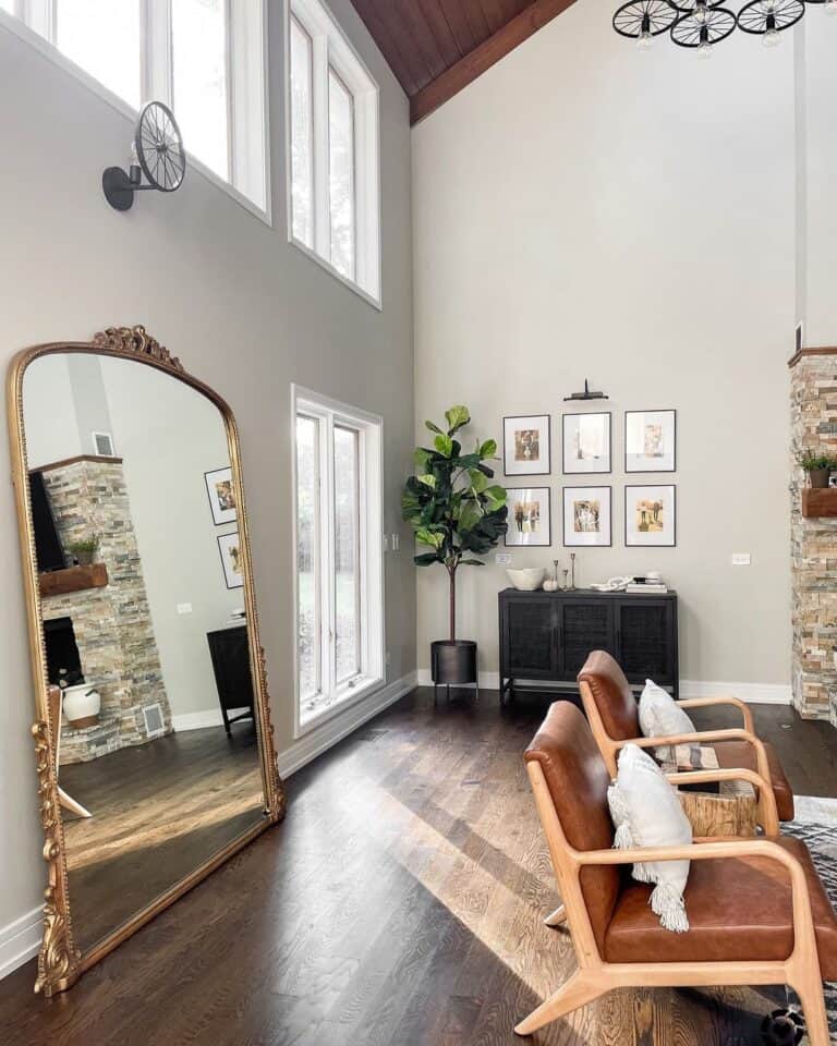 Ornate Gold Filigree Floor Mirror Against a Light Grey Wall