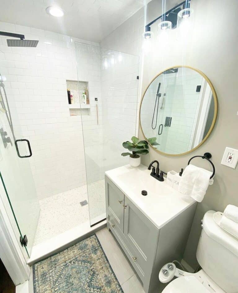 Light Gray Vanity Beneath a Brass Mirror