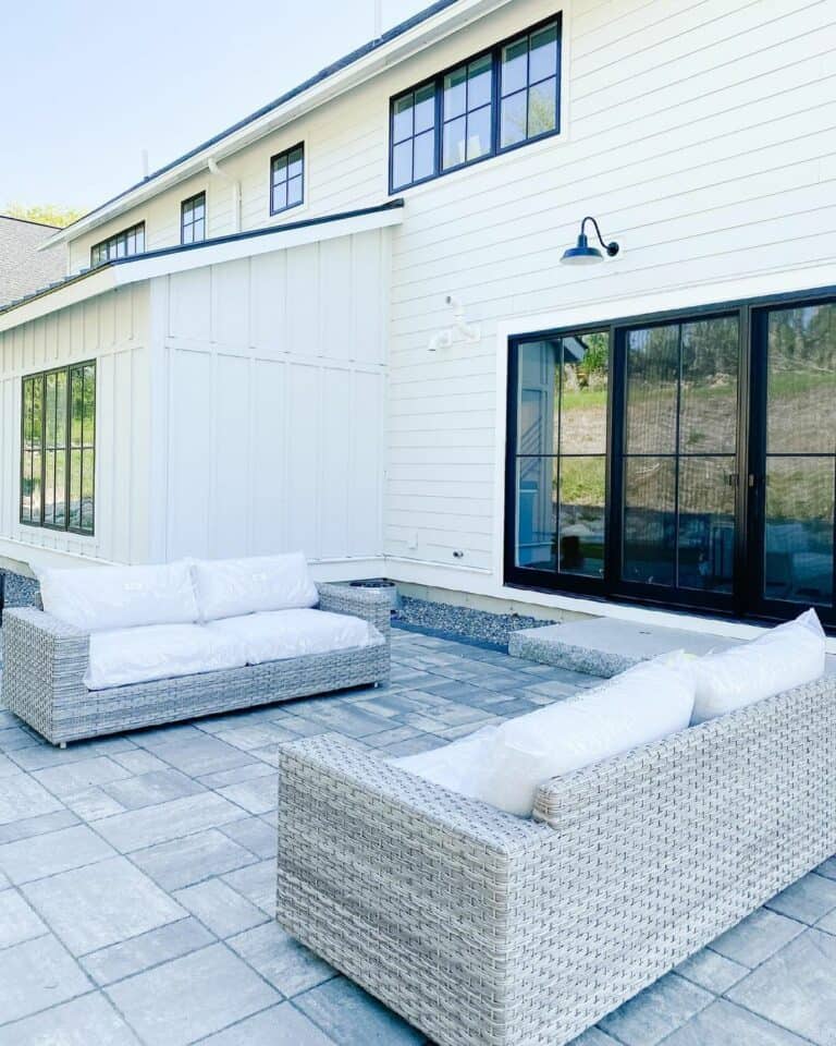 Black Wall Light Illuminates Back Patio