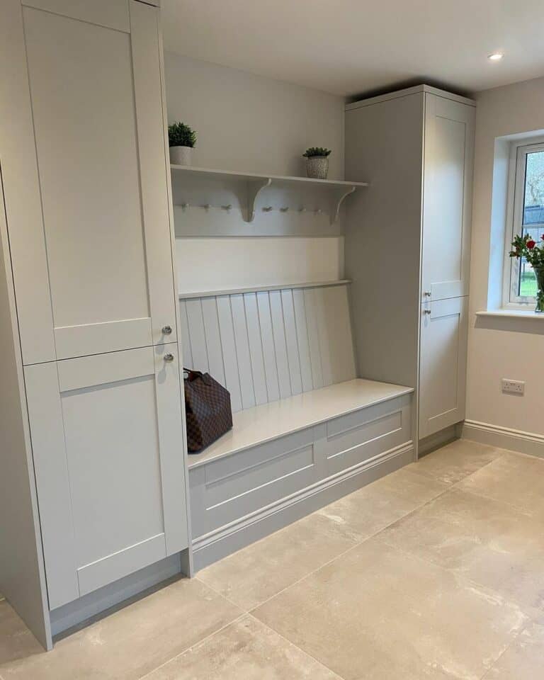 Minimalist Mudroom With Neutral Floor Tiles