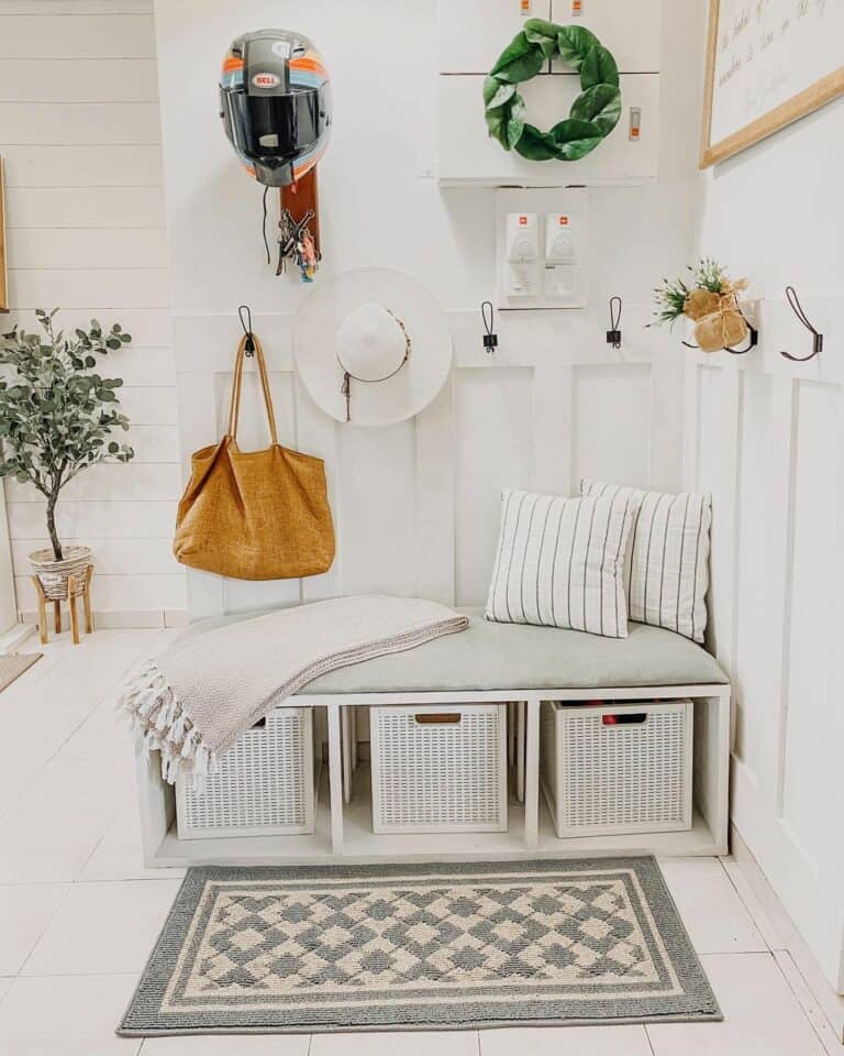 White Farmhouse Entryway With Padded Bench