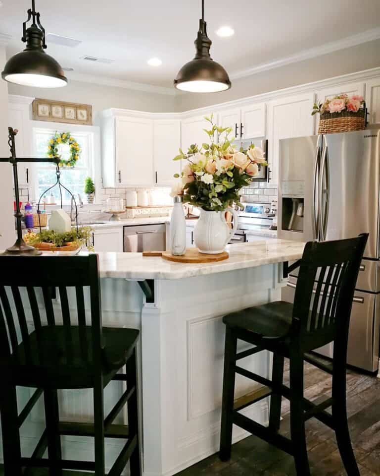 Bronze Pendant Lighting Over Black Stools