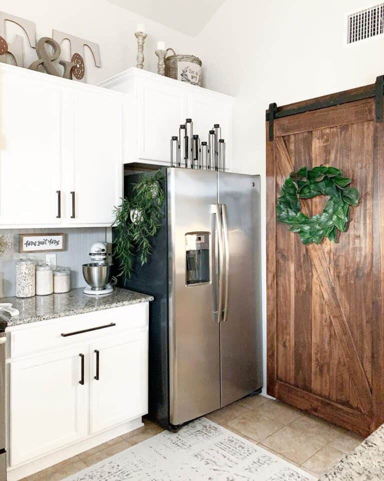 Wood Barn Door in White Cabinet Kitchen