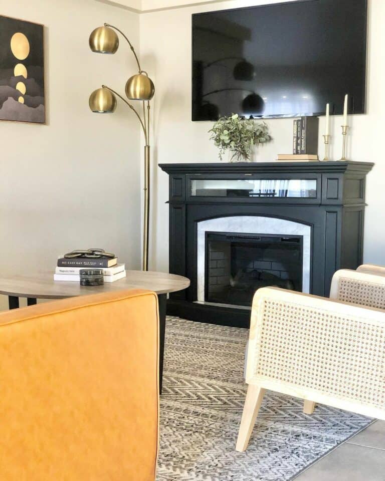 Gold Lamp Beside a Dark Fireplace