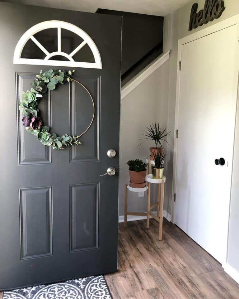 Green Wreath On an Open Iron Ore Front Door