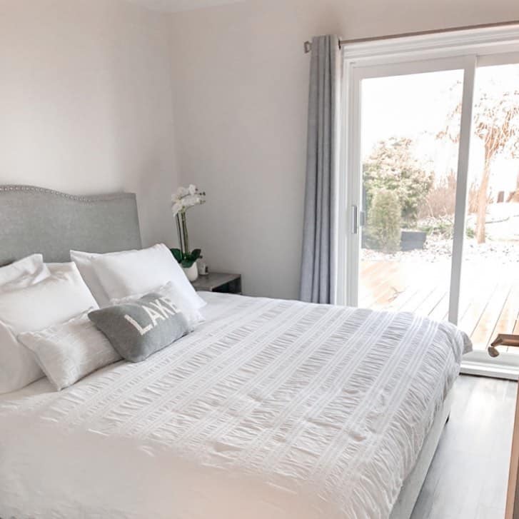 Walk-out Bedroom With Gray Accessories