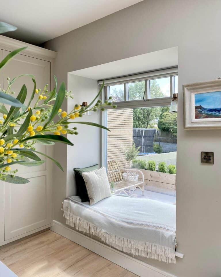 Window Seat Surrounded by Gray Walls