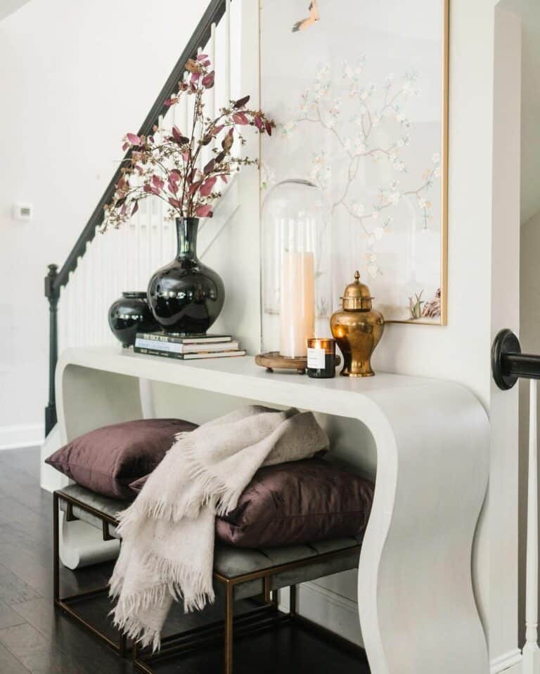 Neutral Entry With Plum and Gold Accents