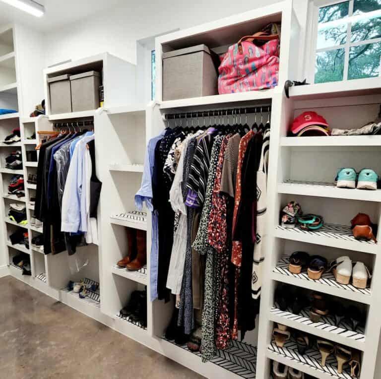 Spacious Walk-in Closet With Storage Boxes and Oak Flooring