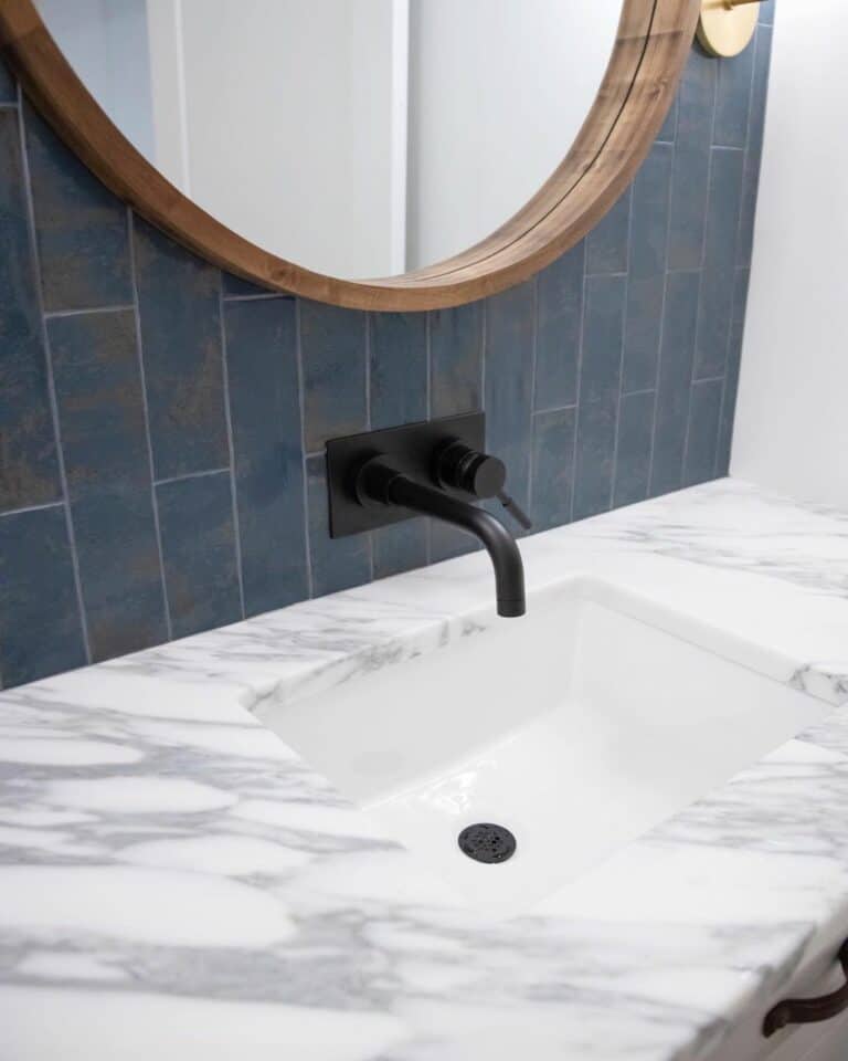 Blue Tile Bathroom Wall Above Marble Countertop
