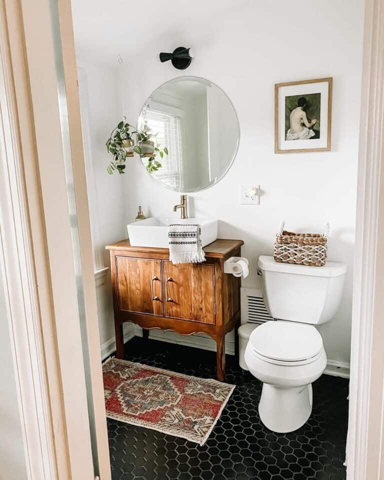 Black Hex Tile Flooring Hosts Antique Vanity
