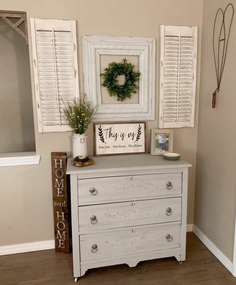 Distressed Shutters Hung Over a Dresser