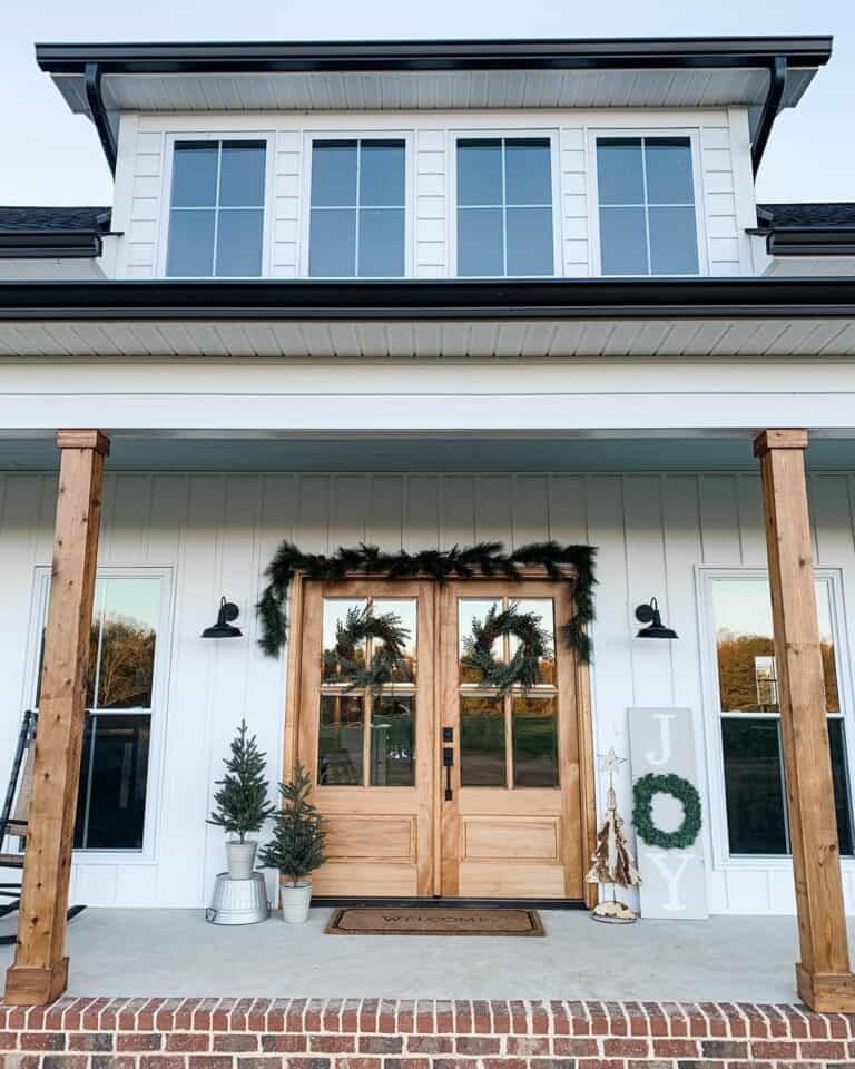 White Farmhouse Porch With Christmas Décor