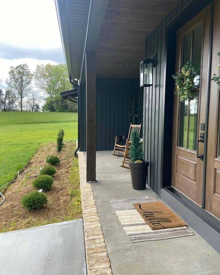 Modern Black Porch With Rocking Chairs