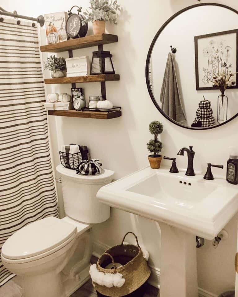 Pedestal Sink with Black Round Bathroom Mirror