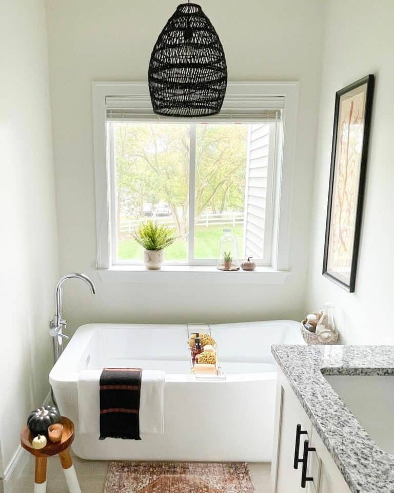 Freestanding Bathtub Positioned Beneath a Window
