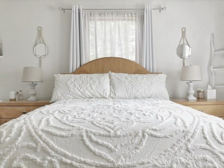 Delicate White Coverlet and Light Wood Bedside Tables