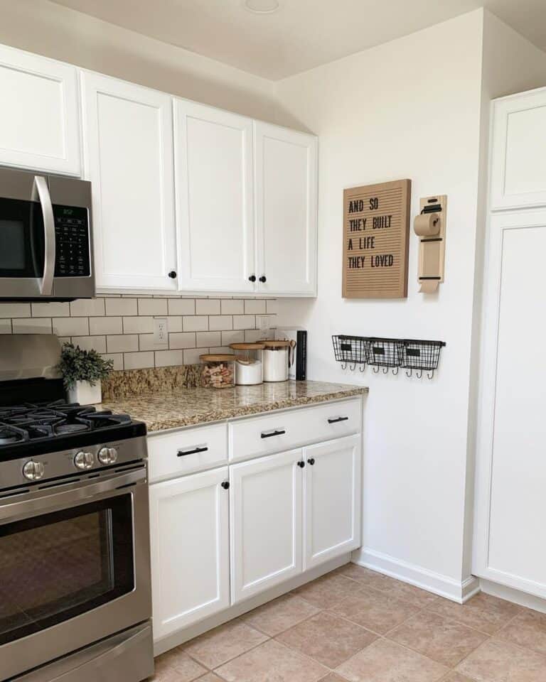 White Kitchen with Black Hardware and Granite Counters