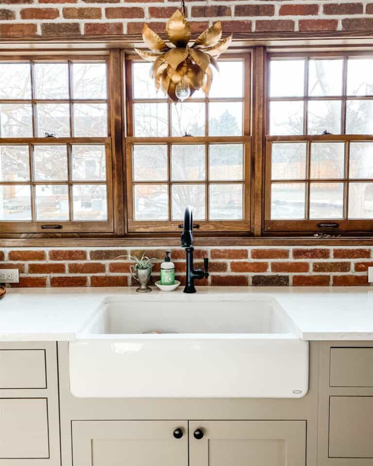 Brick Backsplash Emphasized by Wood Trim