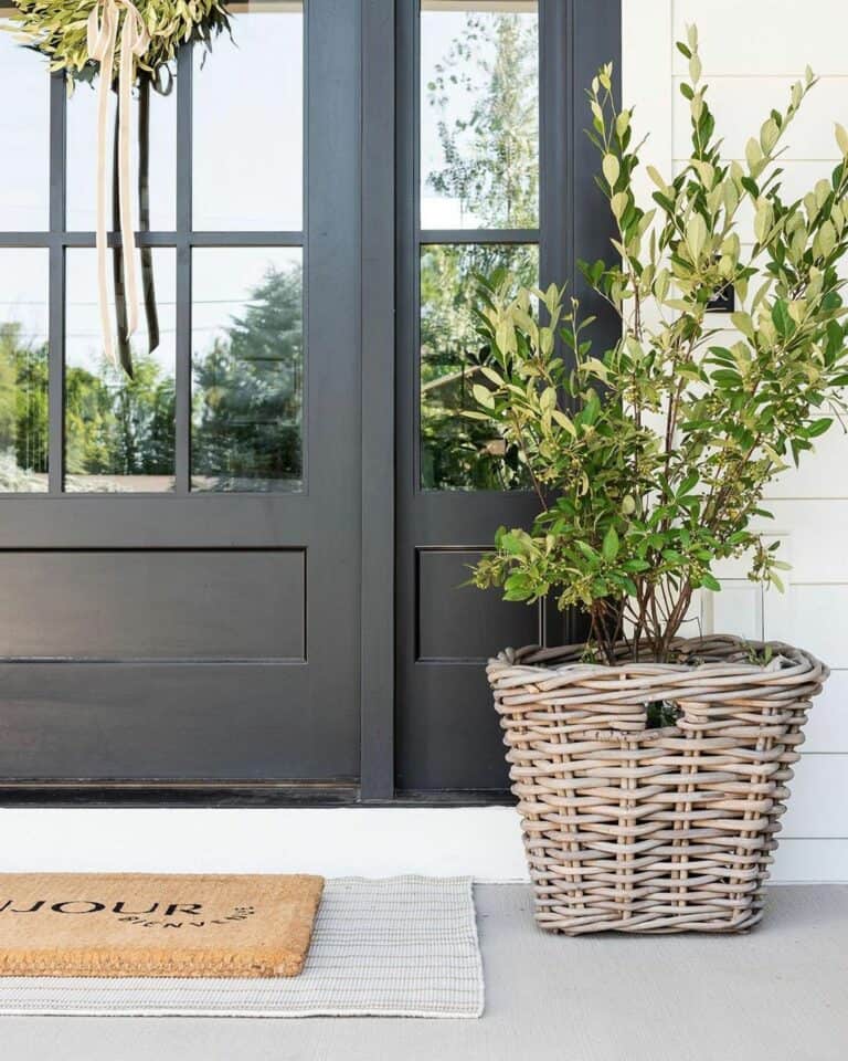 Neutral Farmhouse Porch With a Black Doorway