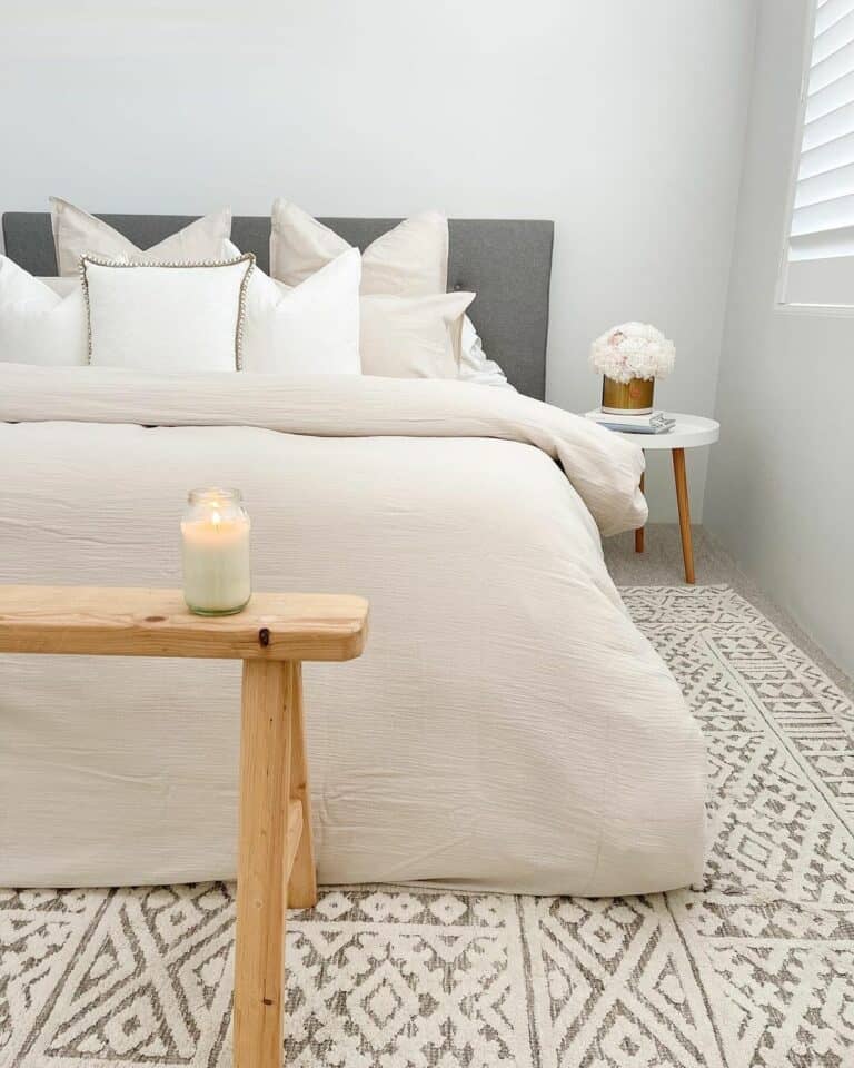 Beige and Grey Bedroom With Sawhorse Bench