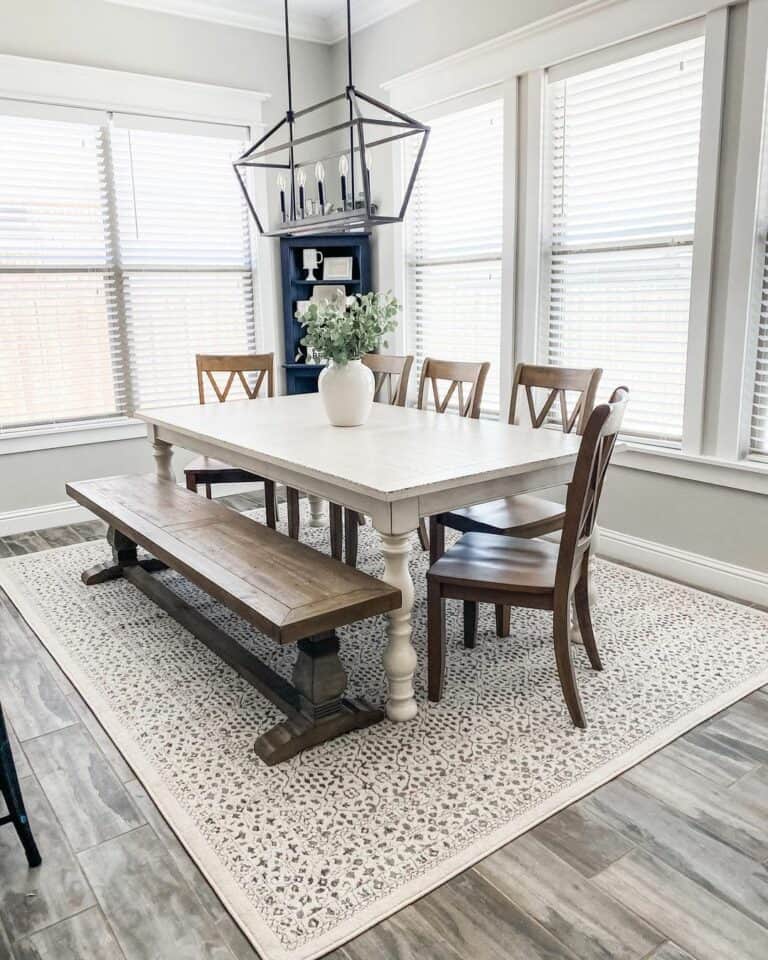 White Farmhouse Dining Table Atop Beige Carpet