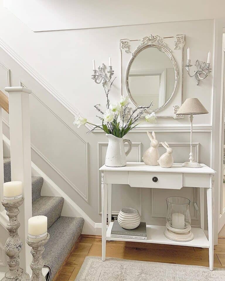 Grey and White Wall Decor Hanging Over White Flowers