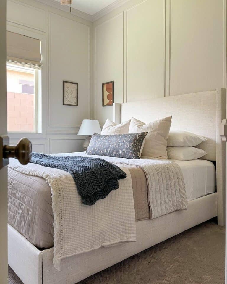 Dark Blue Blanket and Bolster on Beige Bedding