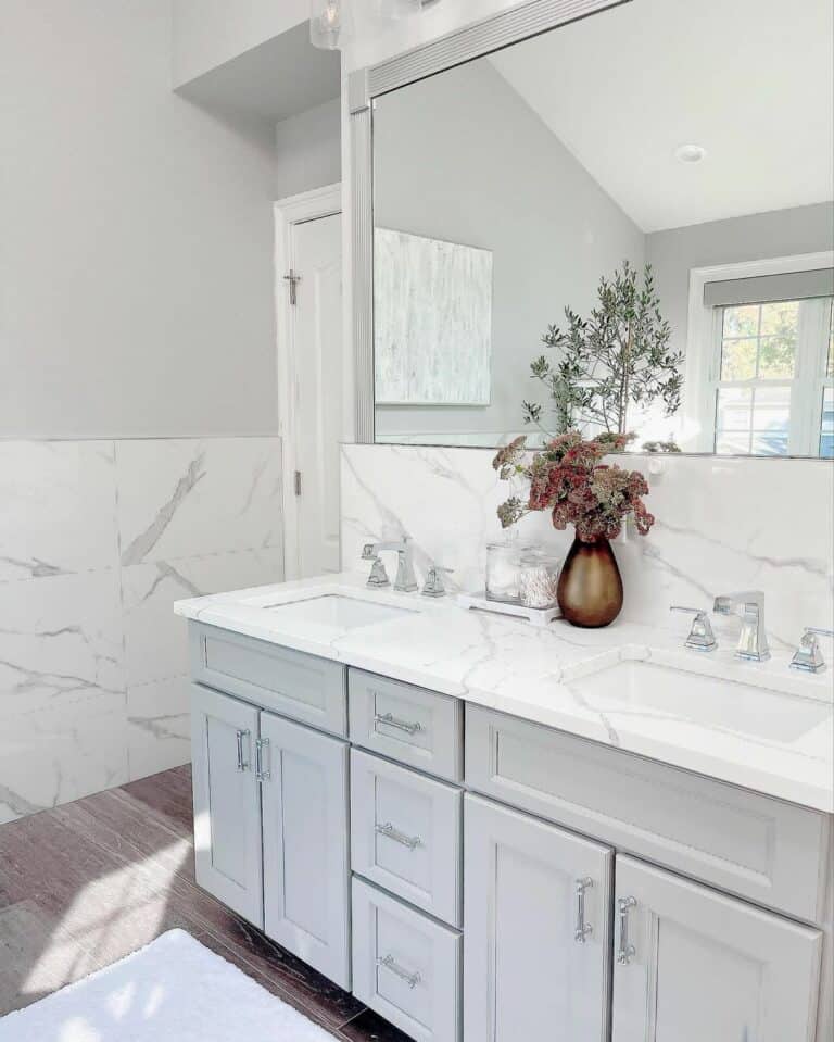 Light Gray Vanity Contrasts White Marbled Walls