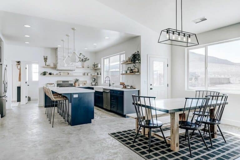 Open Kitchen Layout With Black Spindle Dining Chairs