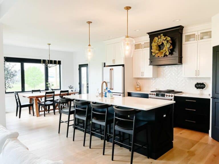 Spacious Kitchen With Black and White Island