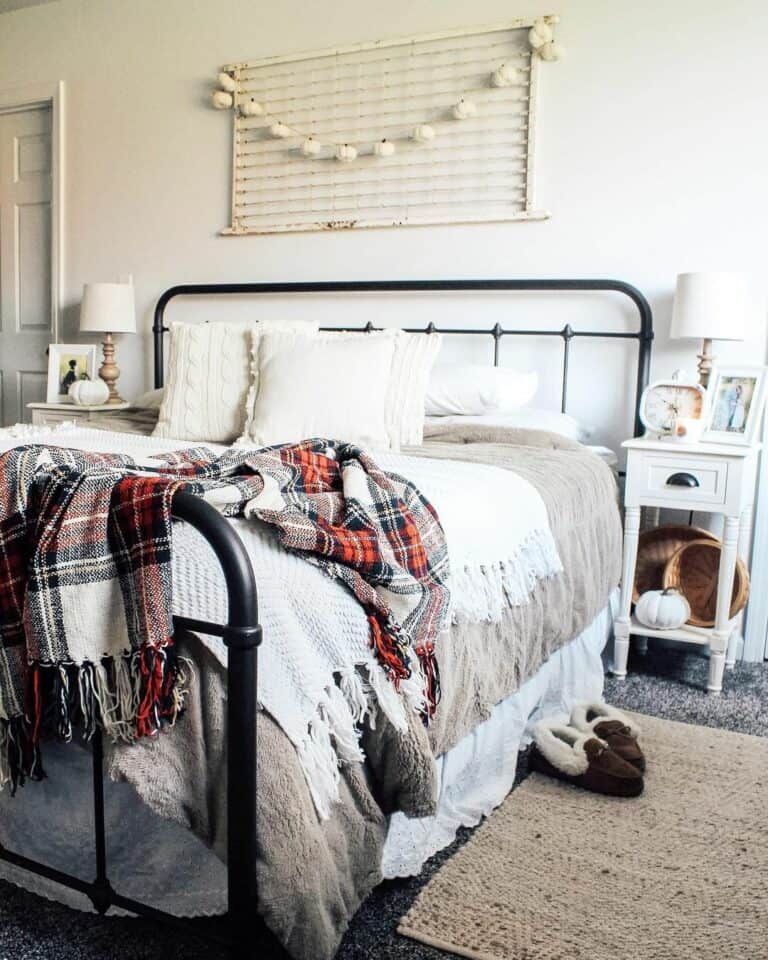 Rustic Metal Bedframe With Vintage Autumn Wall Décor