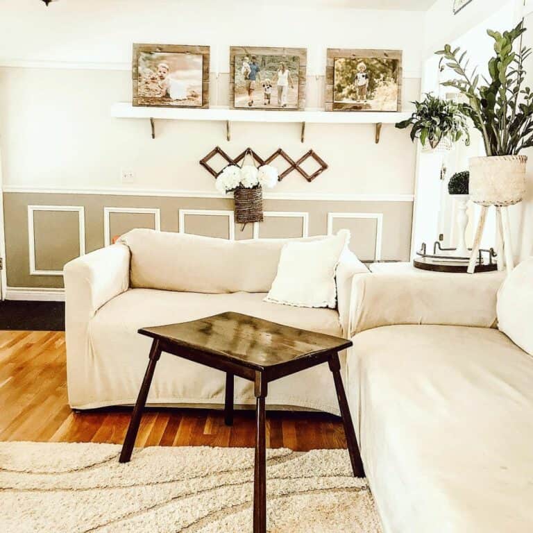 Small Brown Table Surrounded by White Seating